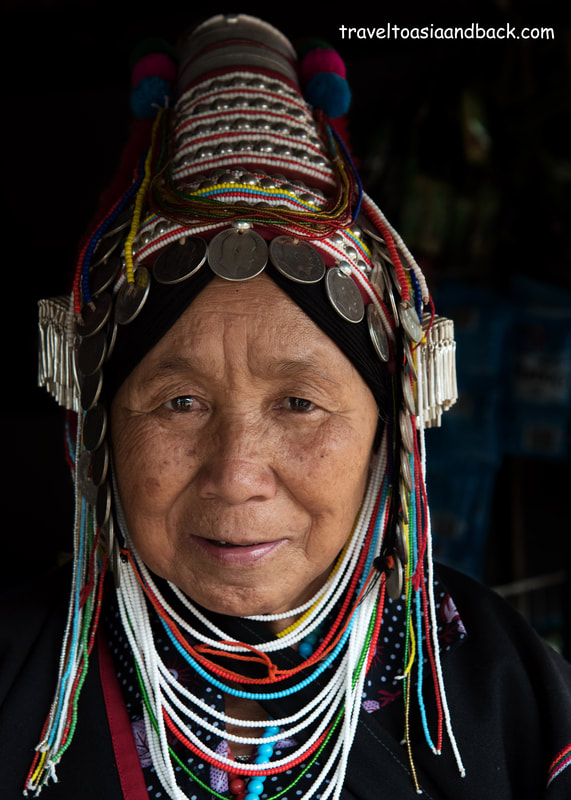 traveltoasiaandback.com - Akha woman wearing a traditional  Akha Uloh costume. Chiang Rai Province, Thailand, Asia