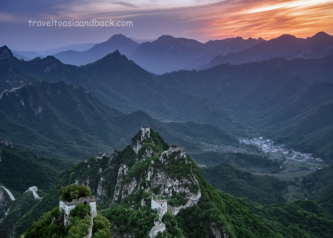 traveltoasiaandback- The sun sets behind the Jiankou Great Wall and Xizhazi village (lower right side)