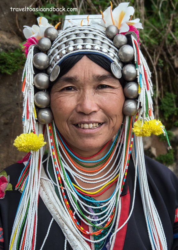 traveltoasiaandback.com - Akha woman wearing a traditional Akha Lomue (Lormee)  costume. Chiang Rai Province, Thailand, Asia