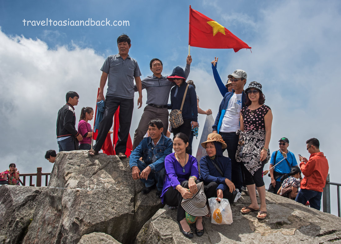 traveltoasiaandback.com - Vietnamese Tourists on the peak of Fansipan, Sa Pa, Lao Cai Province, Vietnam