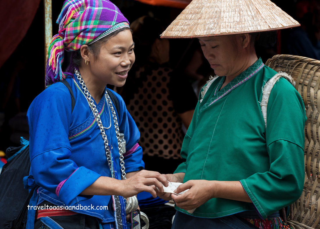 traveltoasiaandback.com - Nung women trading at Vinh Quang Sunday Market, Hoang Su Phi District, Ha Giang Province, Vietnam