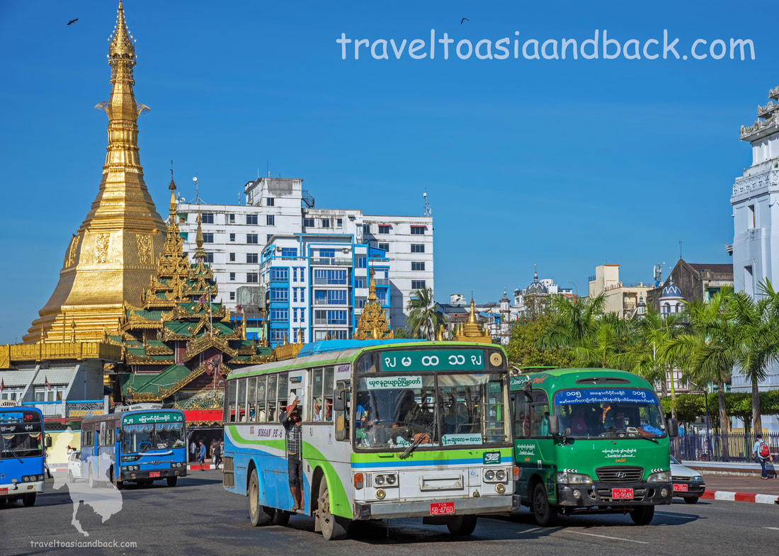 traveltoasiaandback.com -  Local buses pass Sule Pagoda, Yangon, Myanmar